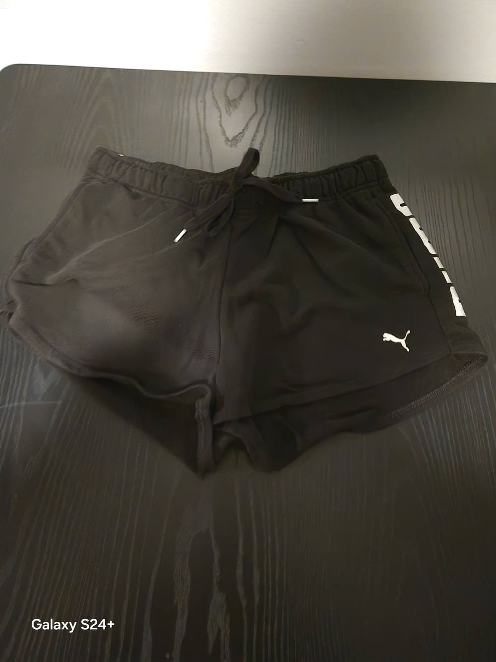 Puma Black Athletic Shorts with White Puma Logo and Side Stripe